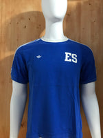 ADIDAS "EL SALVADOR LA GUERRA DEL BALOMPIE" #70 EMBROIDERED TREFOIL LOGO Graphic Print Adult T-Shirt Tee Shirt M MD Medium Blue Shirt 2005