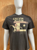 CALVIN KLEIN "THE STRENGTH COMES FROM WITHIN" Graphic Print Adult T-Shirt Tee Shirt XL Extra Xtra Large Dark Gray Shirt