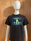 NIKE "WATCH & LEARN" Graphic Print Kids Youth Unisex T-Shirt Tee Shirt L Lrg Large Black Shirt