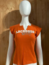 NIKE "LACROSSE" ROCKS THE CRADLE Graphic Print Girls T-Shirt Tee Shirt M MD Medium Orange Shirt