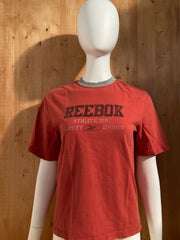 REEBOK "ATHLETIC DEPT" VARSITY DIVISION Graphic Print Kids Youth Unisex T-Shirt Tee Shirt M Medium MD Burnt Orange Shirt